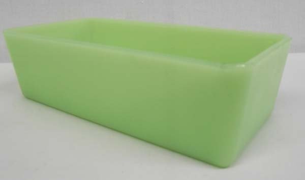 Jadeite Refrigerator Dish: Jadeite Refrigerator Dish. Collectible piece of jadeite, likely Anchor Hocking's Fire King, not marked. The dish measures 8 1/2'' in length and 2 1/2'' high. A couple of edge nicks on both ends.