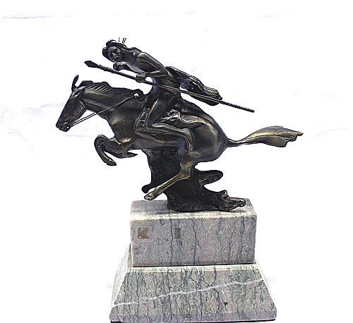Bronze Indian Brave On Marble: Bronze Indian Brave On Marble. Magnificent bronze sculpture of an Indian brave on his galloping steed, spear or lance in hand, brandishing a quirt. His feathered war shield is at his back. The piece m