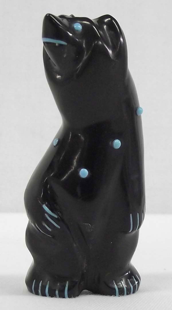 Zuni Fetish Standing Bear by Calavaza: Zuni Fetish Standing Bear by Arnie Calavaza. Striking Zuni fetish by artist, Arnie Calavaza. A standing bear of black jet with turquoise inlay spots and applied turquoise. 2 7/8"H x 1 1/2"W