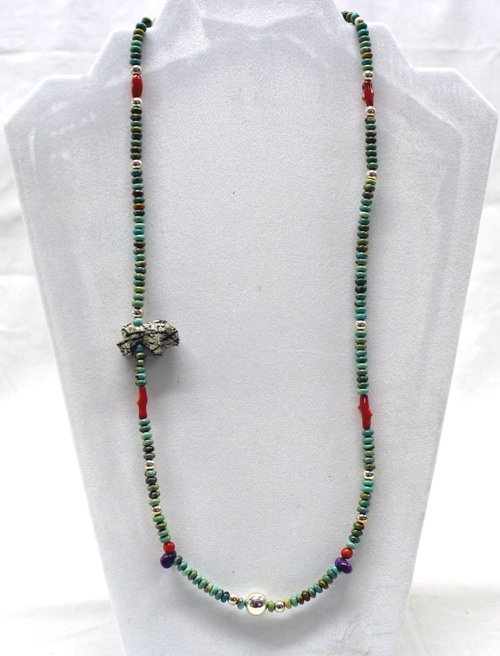 Navajo Multi Stone Turquoise Necklace - Mary Begay: Navajo Multi Stone Turquoise Necklace - Mary Begay, sterling silver beads enhance the turquoise rondelle beads, with accents of coral and sugilite beads, off set carved bear fetish on side of necklace