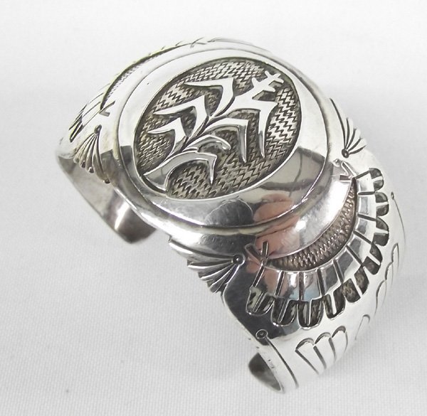 Navajo Silver Cuff Bracelet: Navajo Silver Cuff Bracelet. Handsome piece of silverwork with the central symbol being a stalk of corn. Corn is the symbol of sustenance, the staff of life and an important symbol of many tribes of N