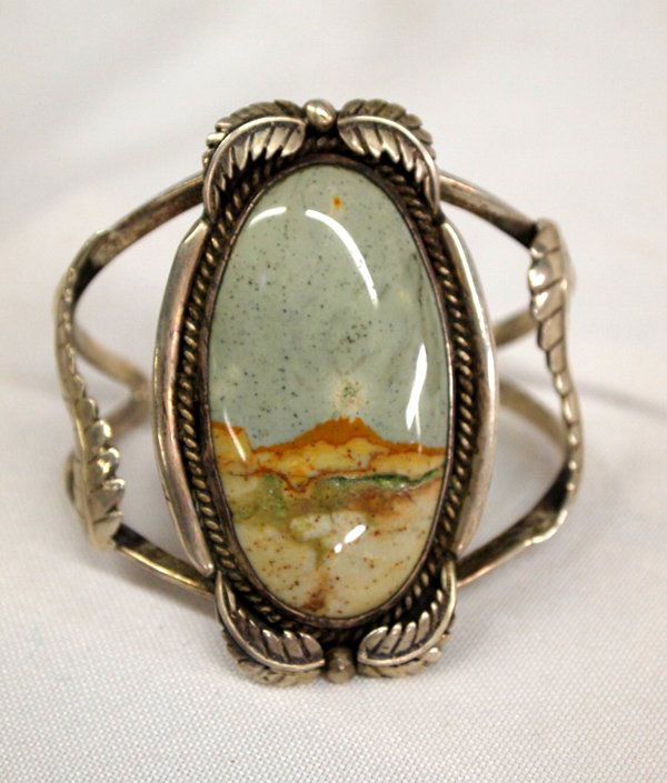 Vintage Navajo Sterling Picture Agate Bracelet: Vintage Navajo Sterling Picture Agate Bracelet, Signed. Rare opportunity to buy a beautiful older piece of art by Glenn & Irene Sandoval. Large sterling silver set with a picture agate. It does have a