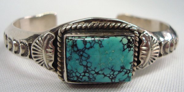 Navajo Sterling Silver Turquoise Bracelet, Signed: Navajo Sterling Silver Turquoise Bracelet, Signed. Navajo silversmith, Eugene Hale, works in heavy sterling silver and in this piece he uses a beautiful turquoise cabochon with black spider web matrix