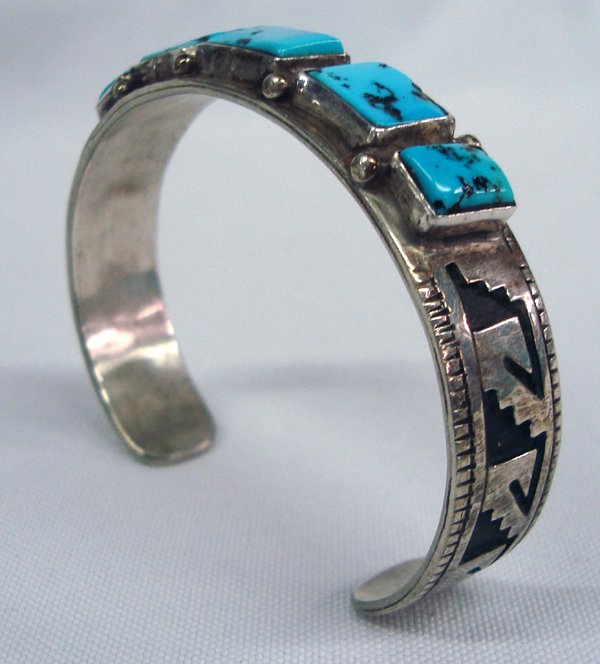Navajo Sterling Silver Turquoise Bracelet, Signed: Navajo Sterling Silver Turquoise Bracelet, Signed. Super nice heavy sterling silver set with nugget Bisbee blue turquoise, 5 square polished cabochons. Hallmarked by the artist, Jacob Kahe. Inside mea
