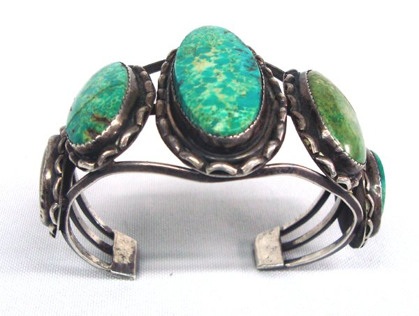 Early 1900's Navajo Sterling & Turquoise Bracelet: Early 1900's Navajo Sterling & Turquoise Bracelet. This is a very old piece of Native American jewelry. Two of the stones are cracked, beautiful patina on the sterling silver commensurate with age. No