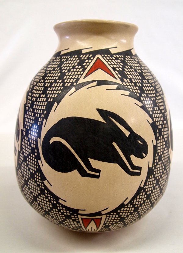 Mata Ortiz Eye Dazzler Rabbit Design Jar - J Villa: Mata Ortiz Eye Dazzler Rabbit Design Jar - J Villa. Pleasing combination of rabbits and eye dazzler diamonds on a tall jar by Jose Villa. Measures 8.5''H x 7''W. Mata Ortiz is a small village in the s