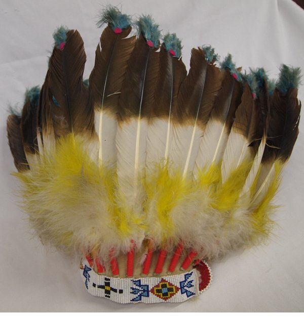 Plains Indian Bonnet: Plains Indian Bonnet, dyed turkey feathers, embellished with beautiful beadwork, colored yarn, felt skull cap, adjustable size, 13''L feathers, very colorful