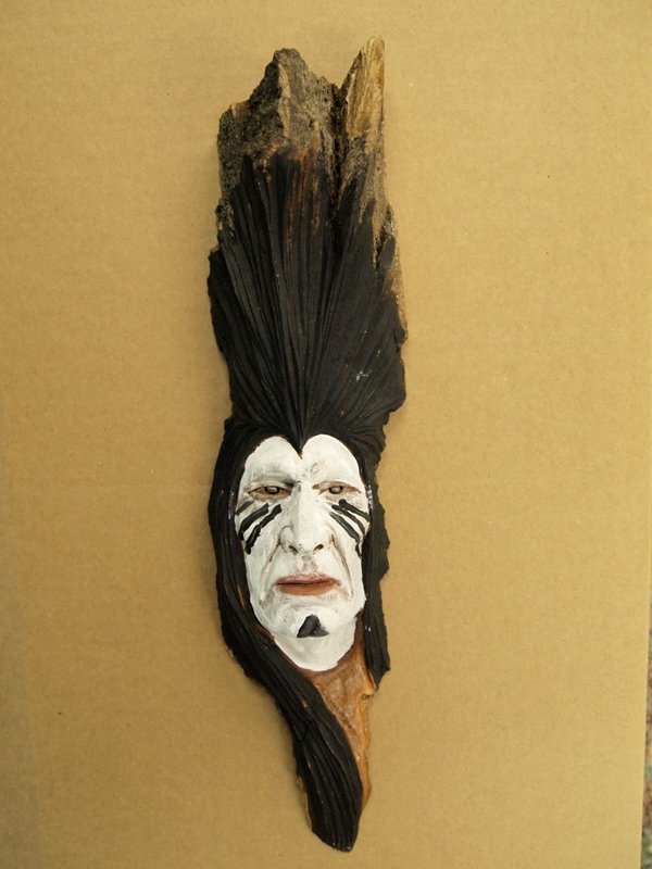 2013 Wood Spirit Carving -- Gordon Raistrick: 2013 Wood Spirit Carving -- Gordon Raistrick, 13.5''H x 3.75''W, Native American Warrior with white and red facepaint, Gordon was born in 1964 on a little Air Force base in New Mexico and has traveled
