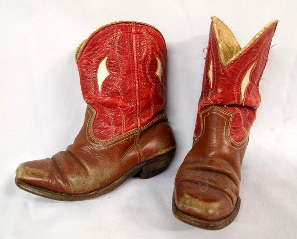 Gene Autry Child's Western Boots, Little Buckaroo: Gene Autry Child's Western Boots, Little Buckaroo. Bootstraps have ''Gene Autry'' woven in the fabric. The boots measure 7'' high and 7'' in length. Red and ivory tops and saddle leather bottoms. This