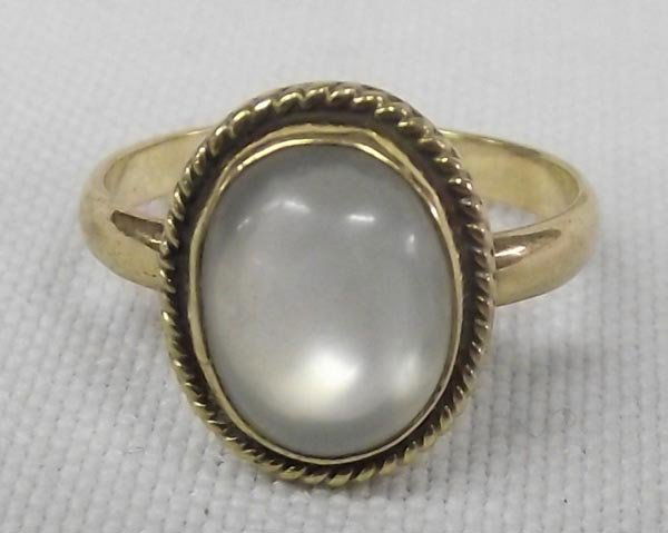 Moonstone Ring 14k: Moonstone Ring 14k. Oval moonstone surrounded by gold rope twist, size 7, marked 14k. Measures 1/2"W
