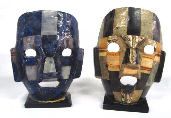 2 Mexican Masks on Stands: 2 Mexican Masks on Stands. These masks are mosaics of stone and abalone glued together and laquered. They measure 8.75''H x 6.25''W.