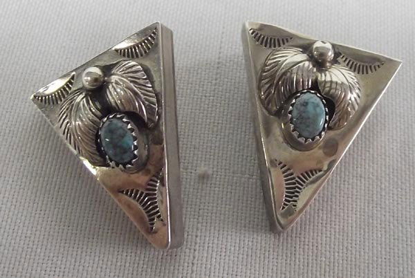 Navajo Sterling Silver Turquoise Collar Tips: Navajo Sterling Silver Turquoise Collar Tips. Stamped designs and overlay leaf designs and a small turquoise cab on each tip. Each measures 1-1/8'' x 7/8''.