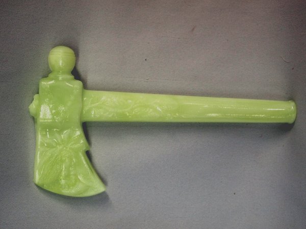 Boyd Vaseline Splash Tomahawk Reproduction: Boyd Vaseline Glass Lemon Splash Tomahawk Reproduction, blade has embossed head of Native American with feathers embossed on handle, hand signed on back of blade Bernard Boyd, glows under black light,