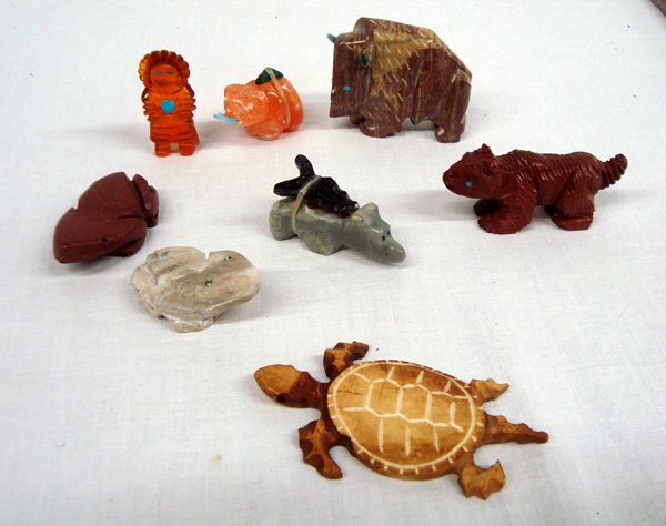 8 Zuni Carved Fetishes: 8 Zuni Carved Fetishes. The frog fetish in pipestone is signed on the bottom, ''KB'' (Kent Banteah) and ''Zuni.'' The buffalo is the largest at 1.5''H x 2''L and has turquoise inlay eyes and turquoise