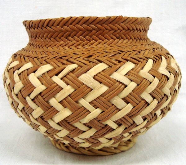 Tarahumara Pine Needle Basket, Double Weave: Tarahumara Pine Needle Basket, Double Weave. Intricut workmanship in this two toned double weave pine needle basket. It measures 4'' high, the opening is 3 1/4'' and the widest point across the body i