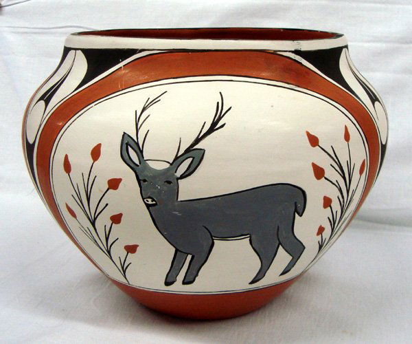 Large Zia Traditional Pottery Bowl: Large Zia Traditional Pottery Bowl. Zia bowl with four repeating designs of deer. Gray, reddish brown and black colors on tan with a redish brown interior color. Measures 7-1/8'' H x 9.5''W.
