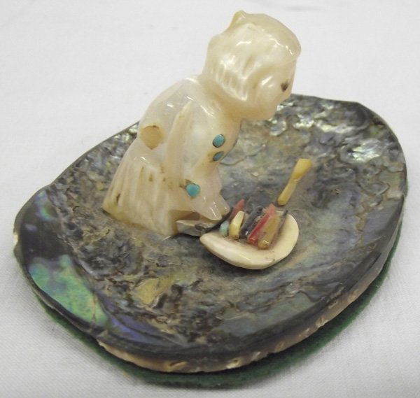Vintage Indian Figure on an Abalone Shell: Vintage Indian Figure on an Abalone Shell. This piece dates from the 1950's with a figure kneeling, inlay eyes and inlay turquoise necklace. She appears to be grinding with pieces of turquoise, coral,