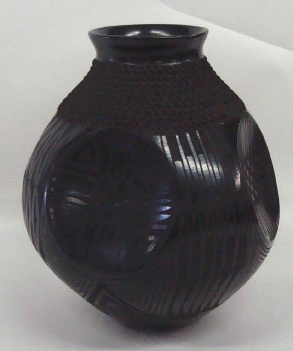 Mata Ortiz -- Jose Gonzalez: Mata Ortiz -- Jose Gonzalez, black on black featuring geometric designs, textured section just below rim, 4 unique and unusual zia symbols set in deep indentations, measures 8''H x 9''W, beautiful pie