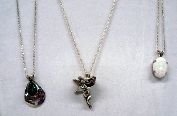 Three Necklaces, Cowboy Angel, Opal and Malachite: Three Necklaces, Cowboy Angel, Opal and Malachite. Nice collection of pendant necklaces on silver chains. The little angel has a cowboy hat, measuring 1 1/4'' length of chain is 22'', the oval opal is