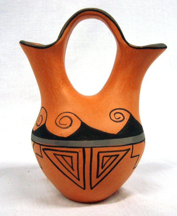 Jemez Pottery Wedding Vase -- Reyes Madalena: Jemez Polychrome Pottery Wedding Vase -- Reyes Madalena, signed on bottom by artist Reyes Madalena Jemez along with little pueblo hallmark, measures 4.5''H x 3.5''W, features geometric maze triangles