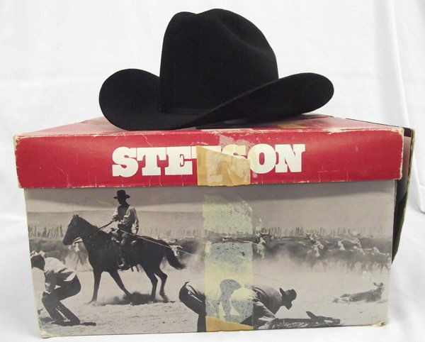 Stetson XXX Cowboy Hat in Original Box: Black Stetson XXX Cowboy Hat. Genuine Stetson hat, size 7-1/4''. Matching ribbon hat band. Original box included.