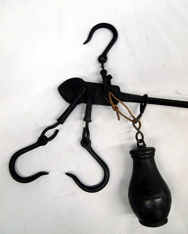 Antique Cast Iron Steelyard Tree Balance Scale: Antique Cast Iron Steelyard Balance Beam Meat Scale. Balance beam weighs up to 50lbs on one side and 100lbs on the other. Measures 32''L x 2.25''W.