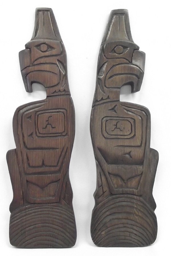 2 Northwest Coast Carved Wooden Totems & Paddle: Two Northwest Coast Carved Wooden Totems, Paddle. The Totem Plaques by JCB. 14.25''H x 4''W, Northwest Coast art is the term commonly applied to a style of art created primarily by artists from Tlingi