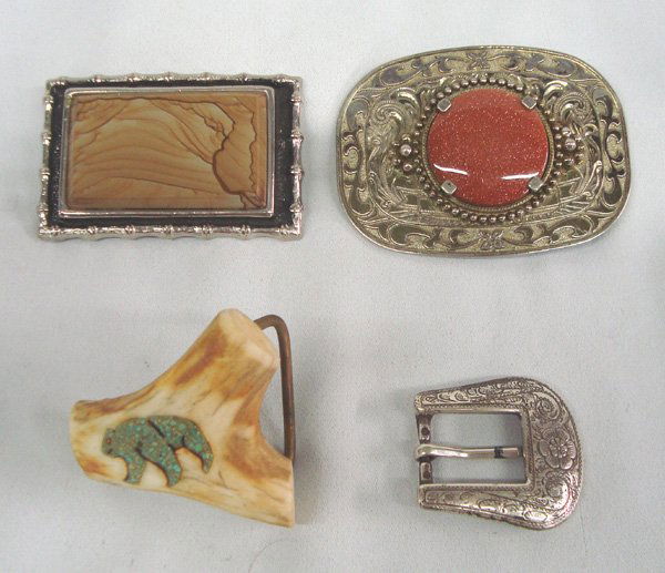 Belt Buckles: Four Belt Buckles. 1) Largest sandstone or sunstone measures 2.75'' x 3.75L. 2) Picture jasper is 2''H x 3.25W. 3) Antler has chipped turquoise bear design 4) Engraved buckle in the old style. Many lo