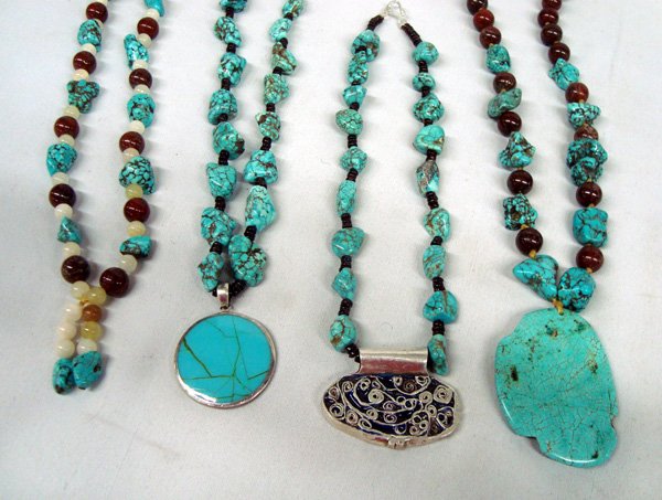 Collection of Stabilized Turquoise Necklaces: Collection of Four Stabilized Turquoise Necklaces, #1 is the longest and measures 30'', #2 24'' long with 2.5''H x 2''W pendant (turquoise and carnelian) #3 24''L and has round reversible pendant with
