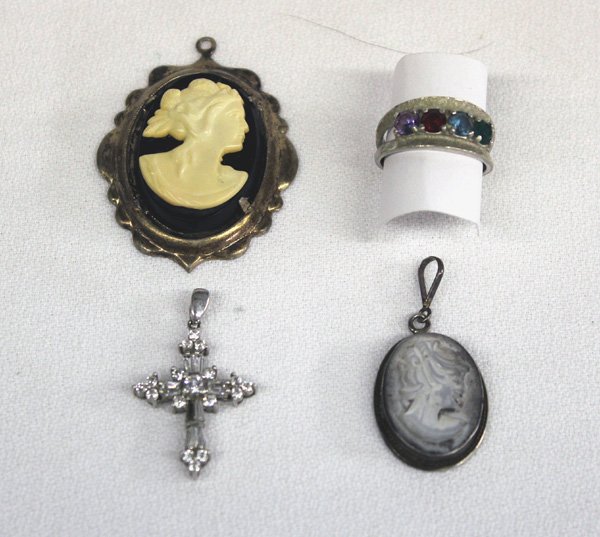 Collection of Gold and Silver Jewelry: Collection of Gold and Silver Jewelry. This wonderful assortment includes: One 10kt white gold amethyst, garnet, aquamarine, and lab emerald ring size 6, and three sterling silver pendants including o