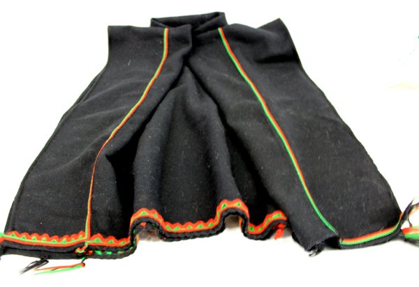 Hopi Black Manta Dress: From the Nick and Suzanne Nicholas Collection we have a Hopi Black Manta Dress, measures 50'' x 38'', features red and green embroidered yarn edging and fringe accents, a manta is a rectangular textil