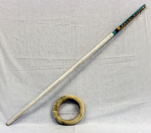 Hopi Gambler's Stick & Hoop: From the Nick and Suzanne Nicholas Collection we have a Hopi Gambler's Stick & Hoop, stick is 41''L x 5/8''D and hoop is 7''D, the majority of the stick is painted white with the exception of the very