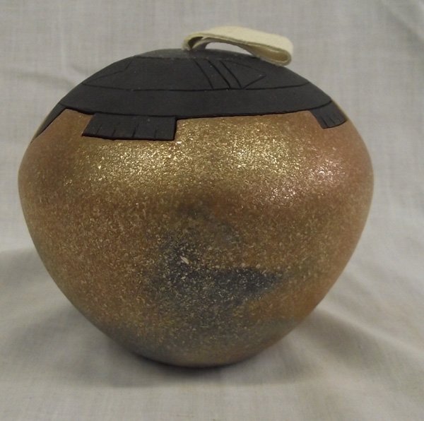 Jicarilla Apache Micaceous Bowl by S. N. Velarde: From the Nick and Suzanne Nicholas Collection we have a Jicarilla Apache Nation Micaceous Bowl by Sheldon Nunez Velarde, measures 4.5''H x 5.5''D, features a very unique black micaceous clay turtle li