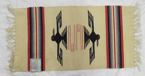 New Mexico Fringed Chimayo Rug: From the Collection of Nick and Suzanne Nicholas. Chimayo Rug, measures 33 in. x 15 in. including fringe, in good condition for age