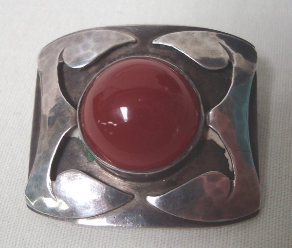 Antique Sterling Silver Carnelian Pin by B Jarne: Antique Sterling Silver Carnelian Pin by B Jarne, measures 7/8''H x 1''W and stone is 5/8''D, stamped sterling hand wrought BJarne, features silver abstract designs