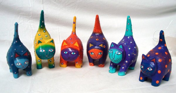 Set of 6 Hand Carved & Painted Albizia Wood Cats: Set of 6 Hand Carved & Painted Albizia Wood Cats. Called ''Fat Cats'', these vividly colored cats have layered paint which adds an interesting texture. The largest is approx. 5''H x 4''W.