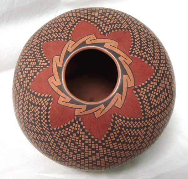 Mata Ortiz Eye Dazzler Jar by Rosa Gaona: Mata Ortiz Eye Dazzler Jar by Rosa Gaona, measures 8''H x 8.5''W, features eye dazzling checkerboard background, with geometric and abstract accent designs on bottom and neck, truly a work of art