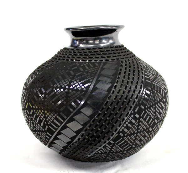 Mata Ortiz Black on Black Jar by Benjamin Soto: Mata Ortiz Black on Black Jar by Benjamin Soto, measures 6''H x 7''W, features textured sections and neck, pulled spout in gun metal finish, eye dazzling checkerboard background with geometric accents