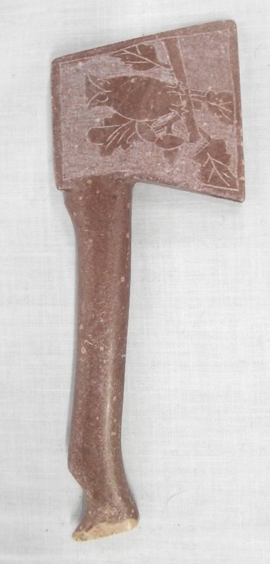 Native American Catlinite Hatchet: From the Collection of Nick and Suzanne Nicholas. Native American Catlinite Hatchet, features etched drawing of owl, measures 5 and 5 eighths in. x 2 in.