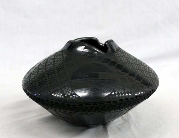 Mata Ortiz Eye Dazzler Jar by Benjamin Soto: Mata Ortiz Eye Dazzler Jar by Benjamin Soto, measures 5''H x 8''W and features gun metal finish, eye dazzling checkerboard design with stylized feathers, and geometric circles and maze designs, cutawa