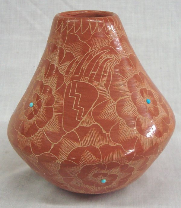 Santa Clara Pueblo Etched & Signed Redware Pottery: Santa Clara Pueblo Etched & Signed Red ware Pottery. This gorgeous pot is Finely etched with 8 tiny turquoise stones. It is signed by artist Julie Gutierrez. This item measures approx. Julie Gutierrez