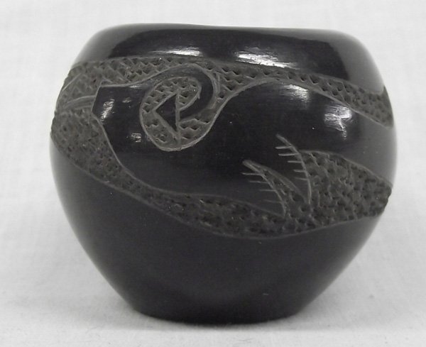 '73 Santa Clara Avanyu Pottery by Art Cody 1943-83: From the Collection of Nick and Suzanne Nicholas. 1973 Santa Clara Avanyu Pottery by Haungooah (Art Cody) 1943-1983, Avanyu meaning Sea Serpent, beautifully etched pottery which measures 2 in. x 1.5 i