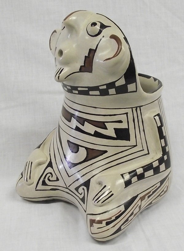 Mata Ortiz Polychrome Effigy Man Pottery - Olivas: From the Collection of Nick and Suzanne Nicholas. Mata Ortiz Polychrome Effigy Man Pottery by Manuel Olivas, measures 6 in. x 8 in., Manuel Olivas (Mata Ortiz) and his daughter Blanca work as a family
