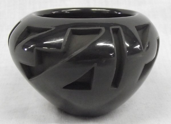 Santa Clara Black Incised Bowl by Carol Velarde: From the Collection of Nick and Suzanne Nicholas. Santa Clara Black Incised Bowl by Carol Velarde, measures 3'' x 2'', Carol Velarde (Santa Clara) was born in 1949 on the Santa Clara Pueblo into a pot