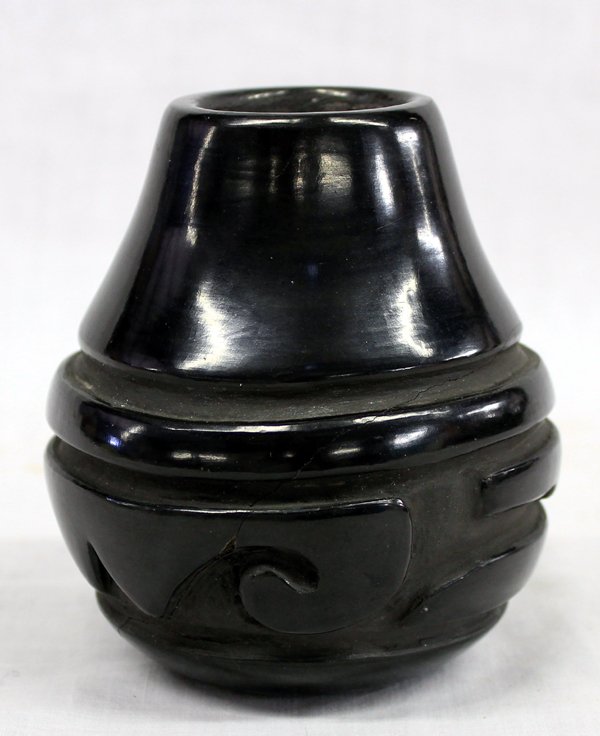 Santa Clara Pueblo Jar by Mary Cain: From the Nick & Suzanne Collection. Santa Clara Pueblo Jar by Mary Cain, measures 4.25''H x 4''W, highly burnished and deeply carved, signed on bottom by artist, Mary Cain (Santa Clara) is one of the 