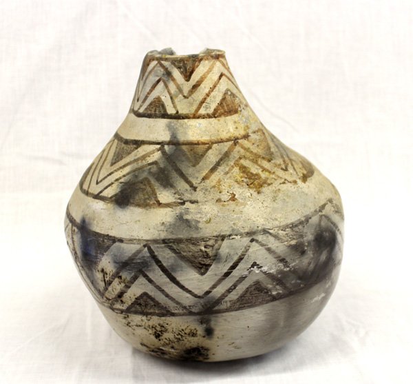 Anasazi Reproduction Black on White Thunder Jar: From the Bill Freeman (deceased) New Mexico Estate, Anasazi Reproduction Black on White Thunder Jar, measures 9'' x 11'', chip in rim, features zig zag designs