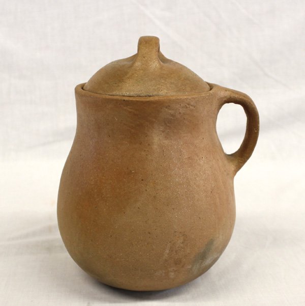 Taos Red Micaceous Clay Bean Pot - Virginia Romero: From the Nick and Suzanne Nicholas Collection we have a Taos Red Micaceous Clay Lidded Bean Pot by Virginia A. Romero, measures 6.5''H x 7''W, single handle, fire clouds, signed on bottom by artist, V