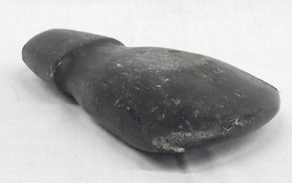 Prehistoric Fully Grooved Stone Axehead: From the Collection of Nick and Suzanne Nicholas. Prehistoric Fully Grooved Stone Axehead, beautiful patina and has the traditional tomahawk shape, measures 5.5 in. x 3.5 in.