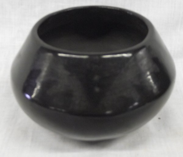 1920-25 Maria Martinez San Ildefonso Black Pottery Bowl: From the Estate of Nick & Suzanne Nicholas. Bowl is signed Marie, which dates the bowl being from 1920-1925. Measures approx. 2.5''H x 5''L. Bowl has protection pads on the bottom. Early works by Mari