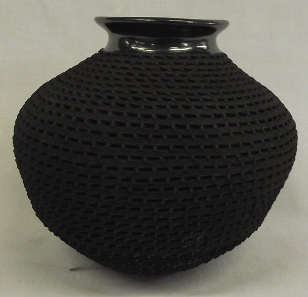 Mata Ortiz Highly Textured Jar by Benjamin Soto.: Mata Ortiz Highly Textured Jar by Benjamin Soto. Really nice this item has full body textured with a pulled spout, gun metal finish, measures approx. 6'' x 7''.